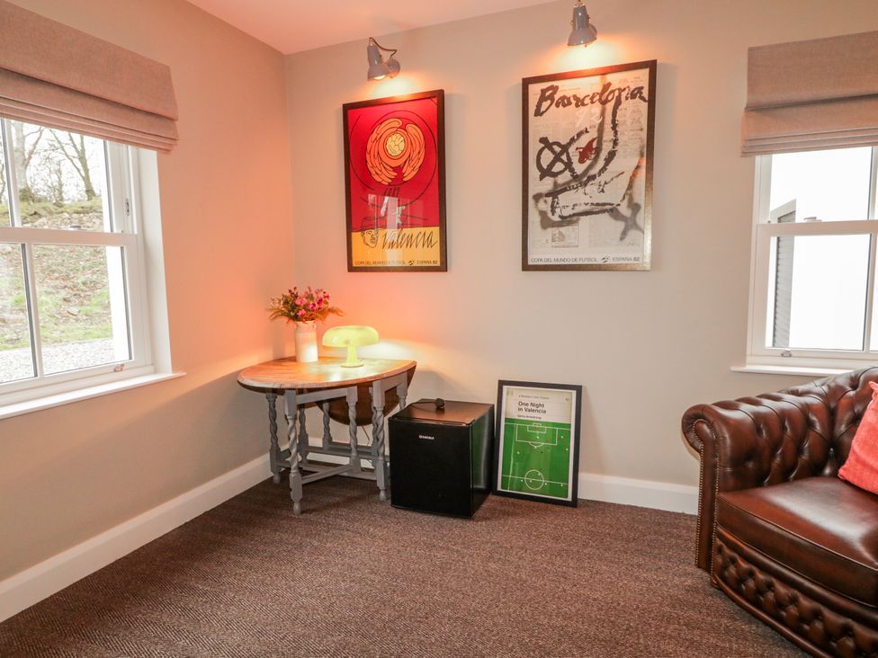 A snug with a table and lamp at Cloneytrace Mines in Broughshane