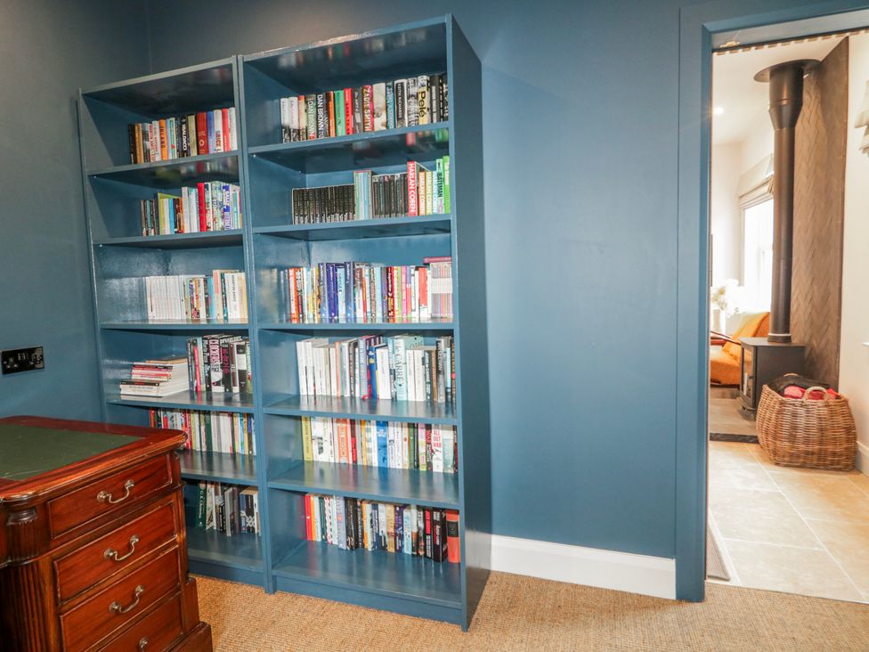A study with a bookshelf and a desk at Cloneytrace Mines, Broughshane