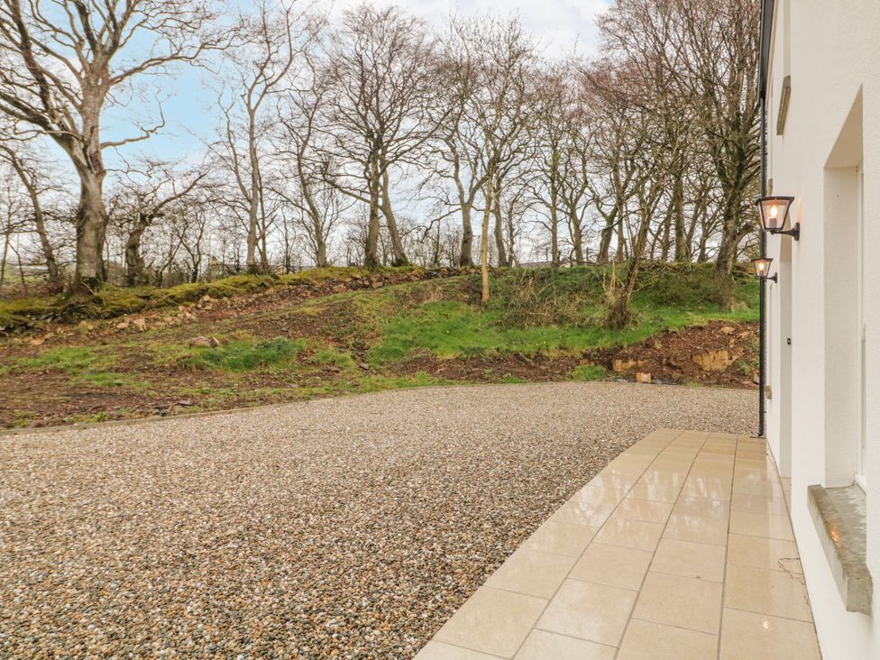 An outdoor area with gravel and trees at Cloneytrace Mines Broughshane