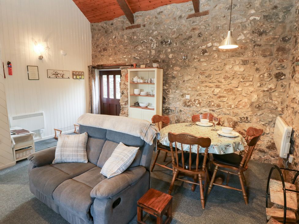A dining room with a table and chairs at 8 Rogeston Cottages Haverfordwest