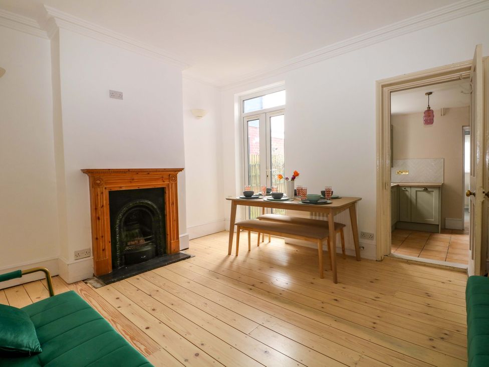 A dining room with a table and chairs at 70 High Street in Canterbury