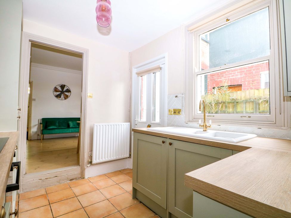 A kitchen with a sink and window at 70 High Street, Canterbury