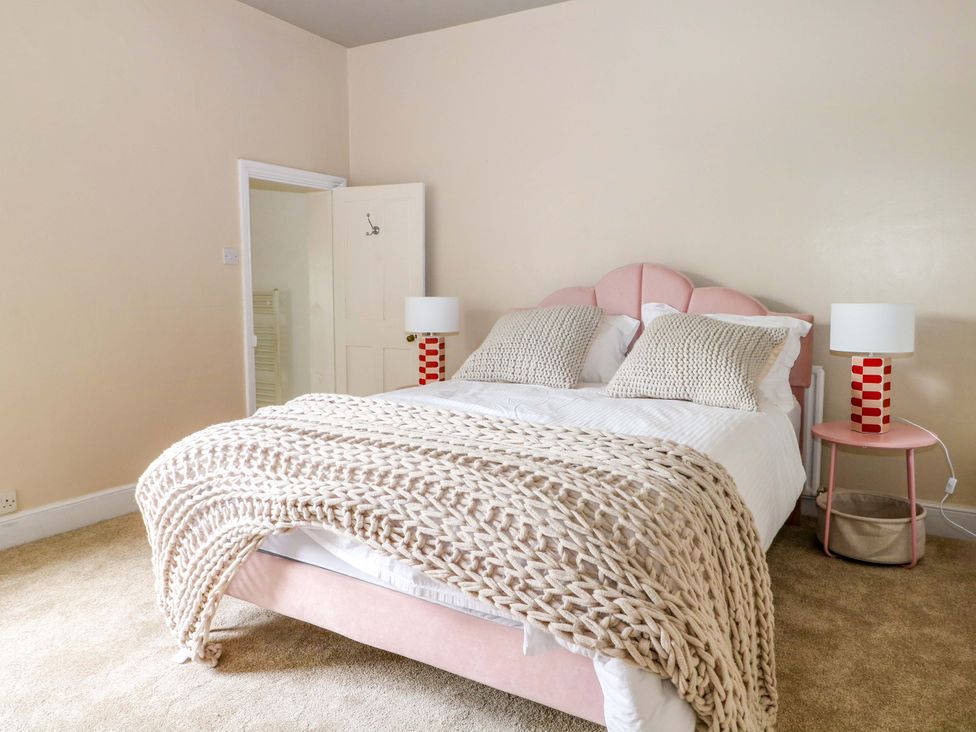A bedroom with a bed and nightstand at 70 High Street, Canterbury
