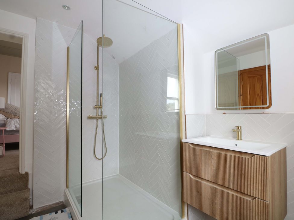A bathroom with a shower and sink at 70 High Street Canterbury
