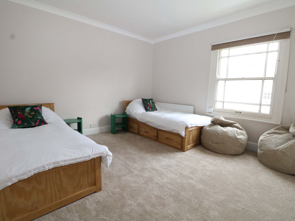 A bedroom with two beds and bean bags at 70 High Street, Canterbury