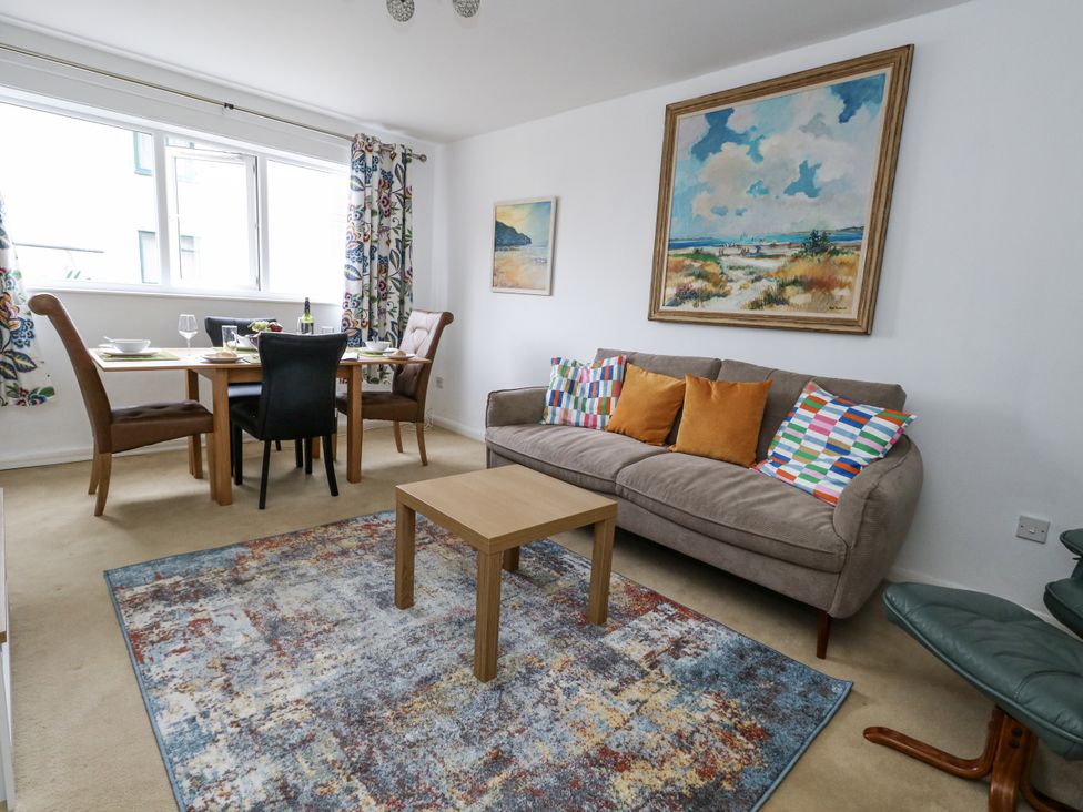 A living room with a table and chairs at Flat 13, Chesil House in Bridport