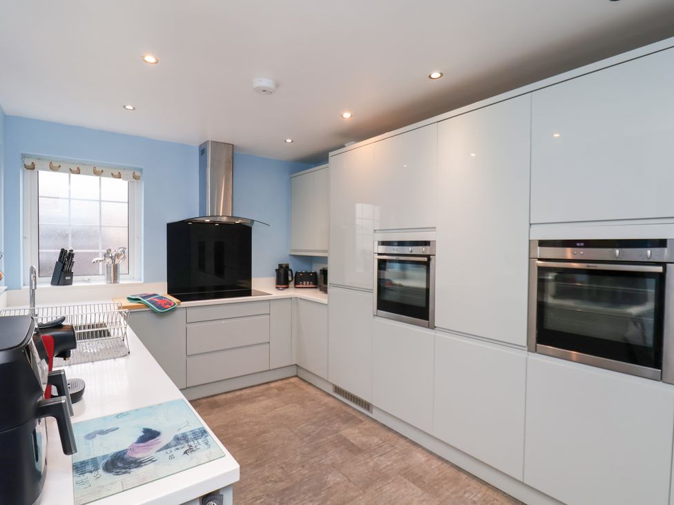 A kitchen with modern appliances at Kingfisher House in Saltburn-by-the-Sea