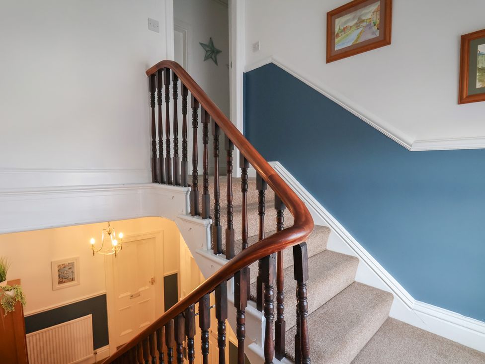 A staircase in a hallway at Kingfisher House Staithes