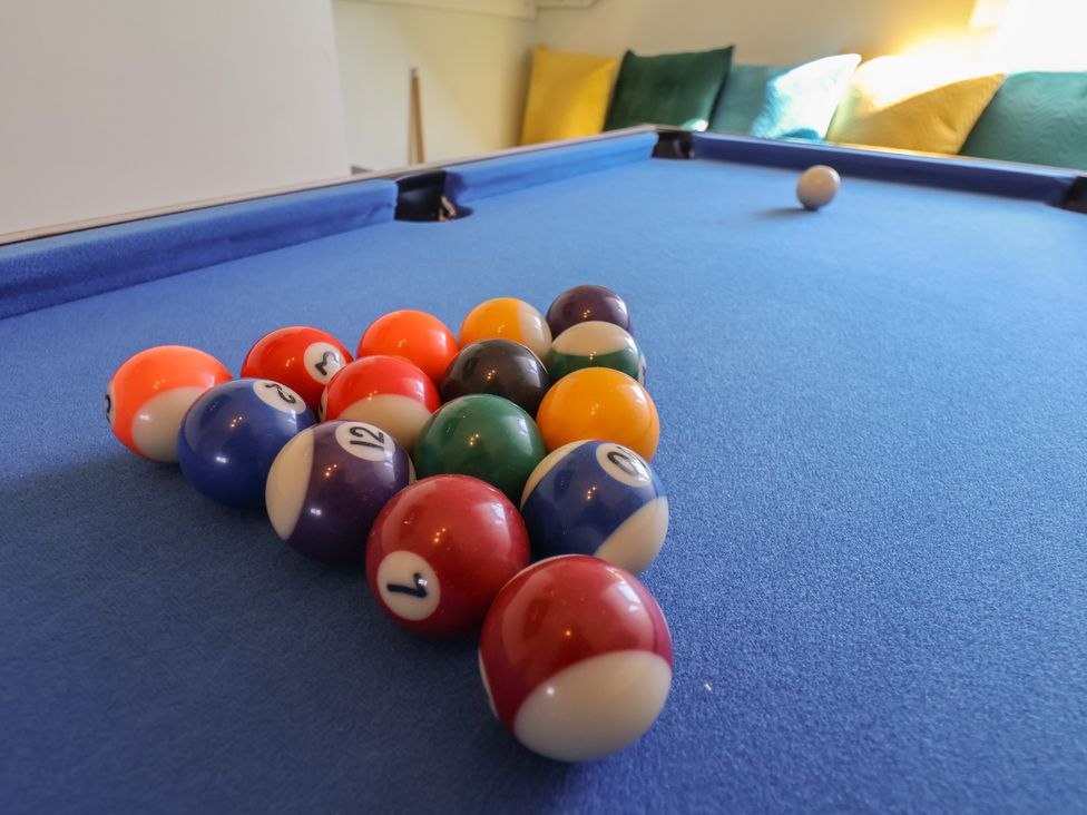 A pool table with billiard balls arranged at Kingfisher House in Staithes