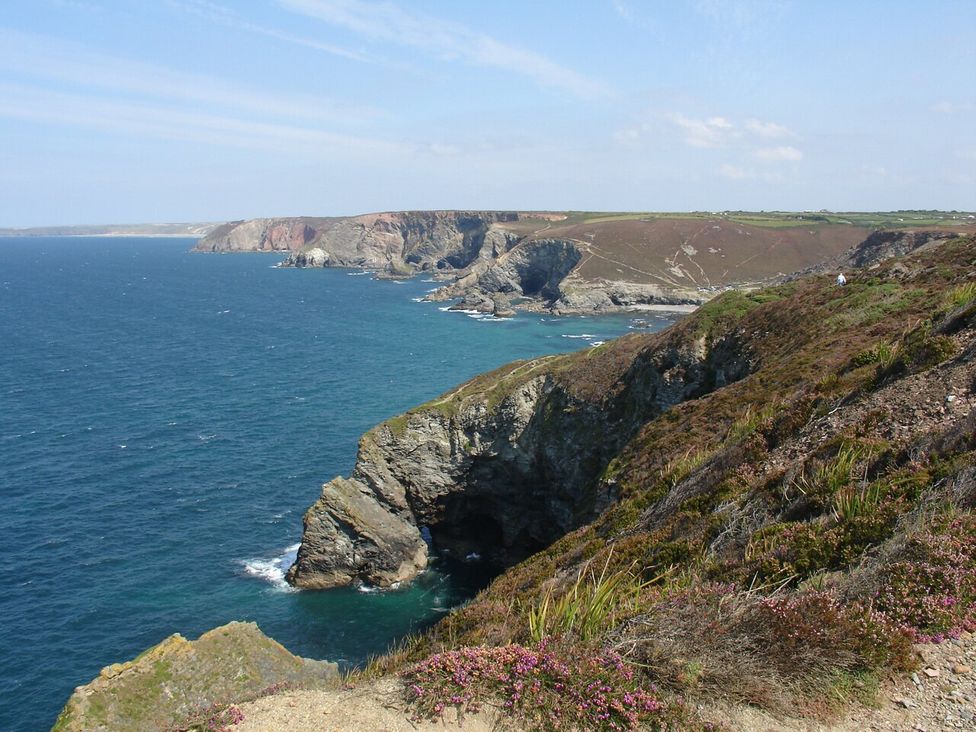 A coastal view with cliffs and ocean at The Old Piggery in Porthtowan, Near St Agnes