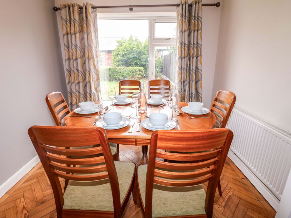 A dining table set with tableware at Oxcroft View Oxcroft near Clowne