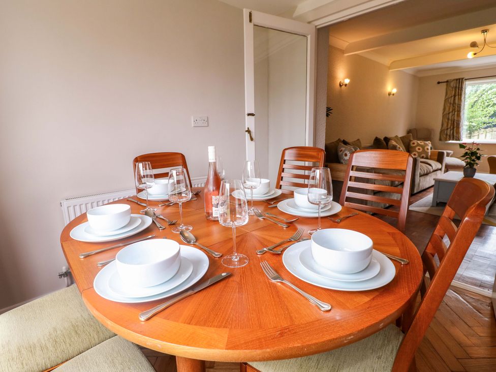 A dining room table set with dinnerware at Oxcroft View Oxcroft near Clowne