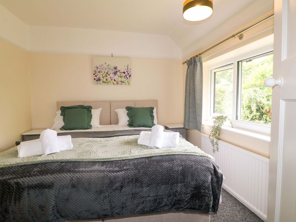 A bedroom with a bed and window at Oxcroft View Oxcroft near Clowne