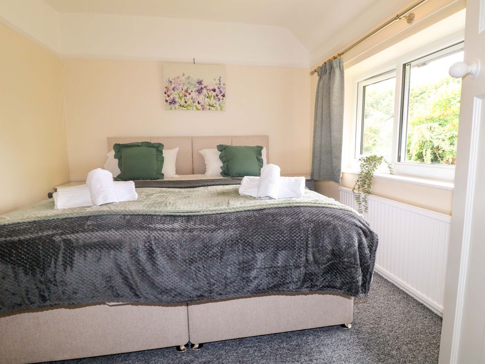 A bedroom with a bed and window at Oxcroft View Oxcroft near Clowne