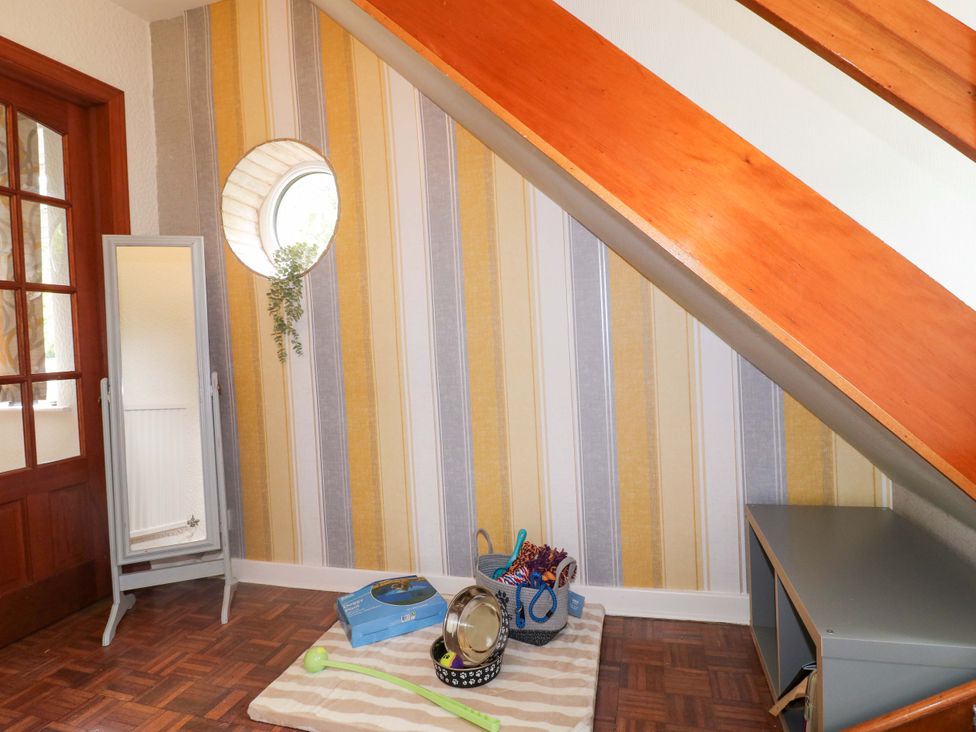 A hallway with a mirror and toys at Oxcroft View in Oxcroft near Clowne