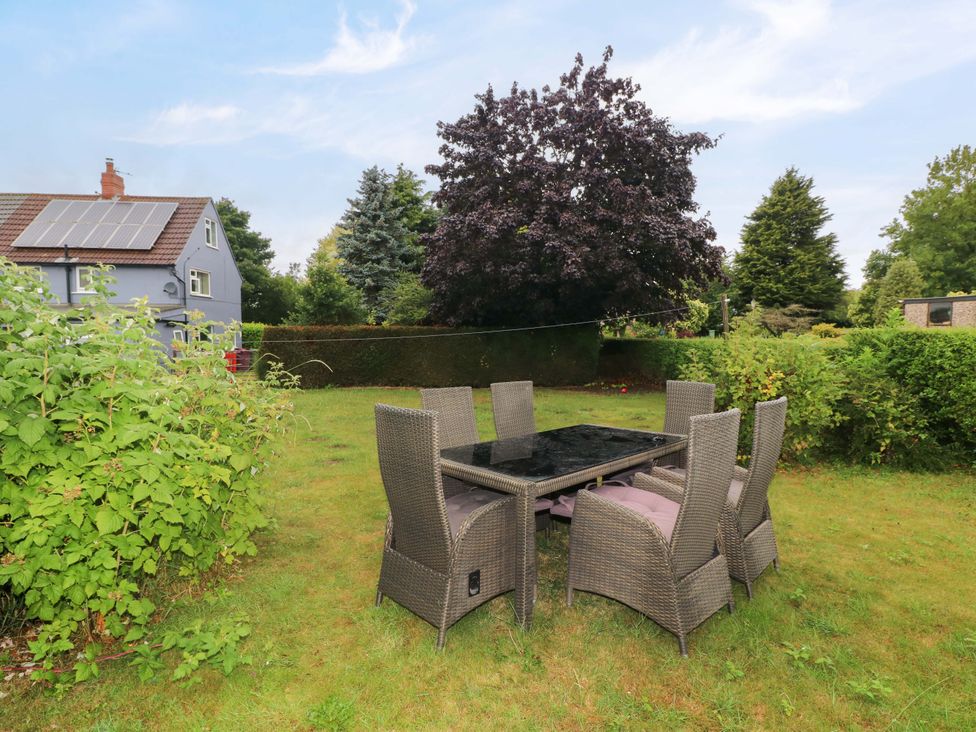 A garden with outdoor furniture and a tree at Oxcroft View in Oxcroft near Clowne