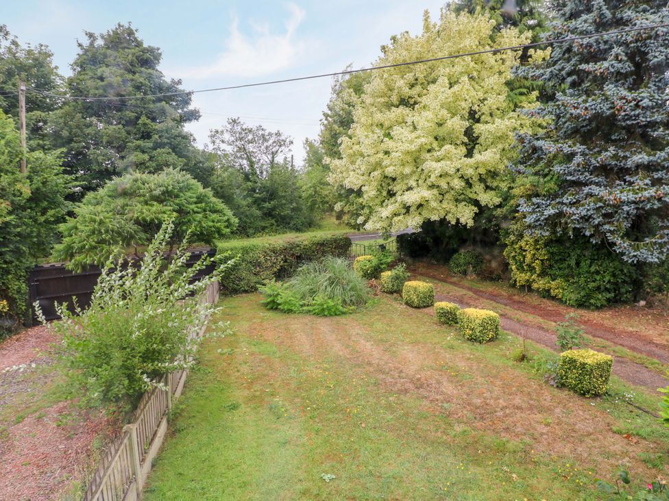 A garden with grass and trees at Oxcroft View in Oxcroft near Clowne