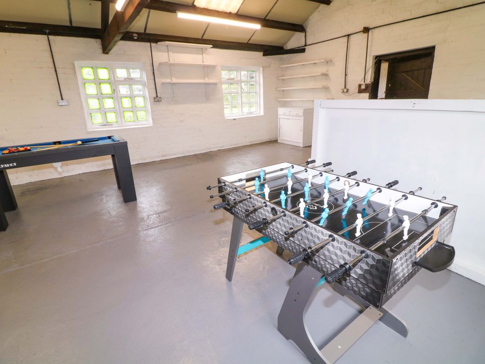 A games room with a foosball table and a pool table at Oxcroft View Oxcroft near Bolsover