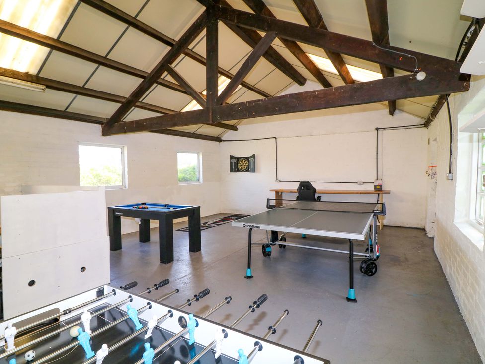 A games room with a foosball table and a table tennis table at Oxcroft View Oxcroft near Bolsover