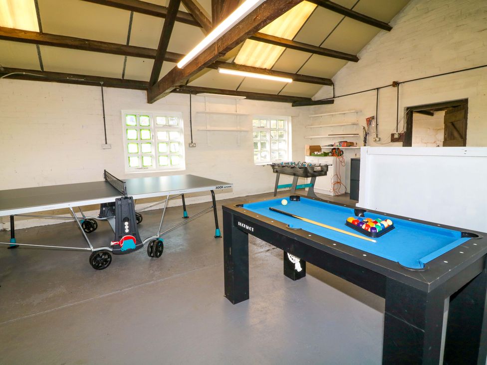 A game room with a ping pong table and pool table at Oxcroft View in Oxcroft near Bolsover