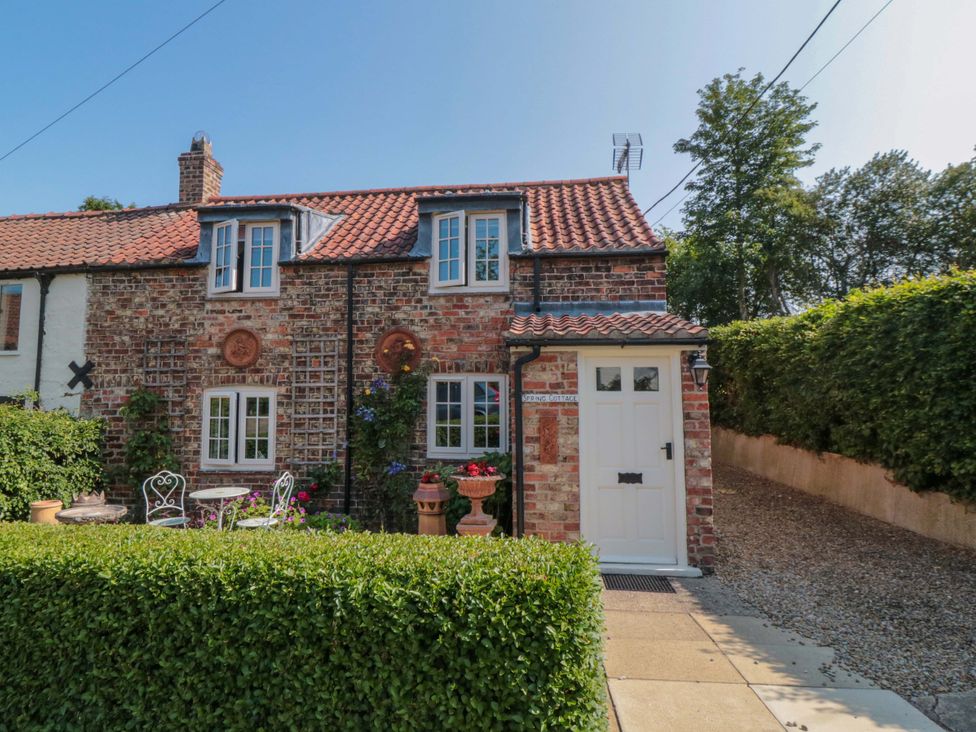 A house with a door and windows at Spring Cottage in York
