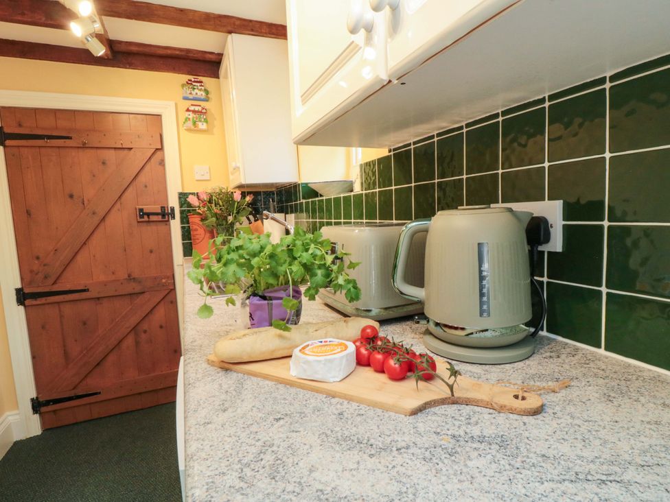 A kitchen with utensils on a countertop at Spring Cottage in York
