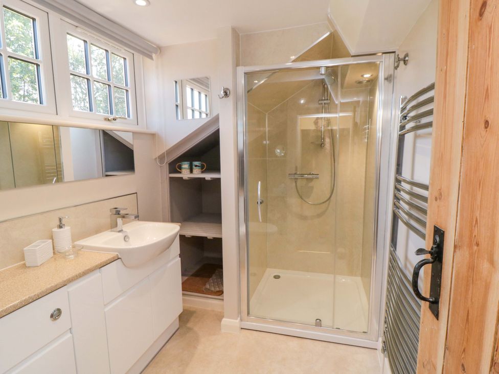 A bathroom with a shower and sink at Spring Cottage in York