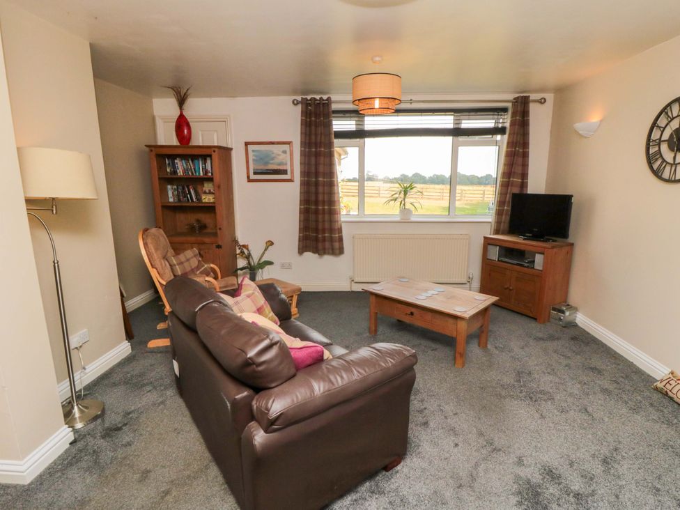 A living room with a coffee table and sofa at The Annex in York