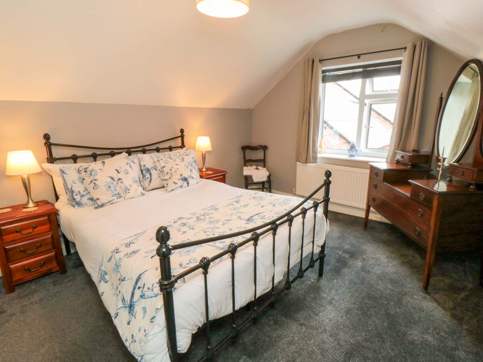 A bedroom with a bed and furniture at The Annex in York