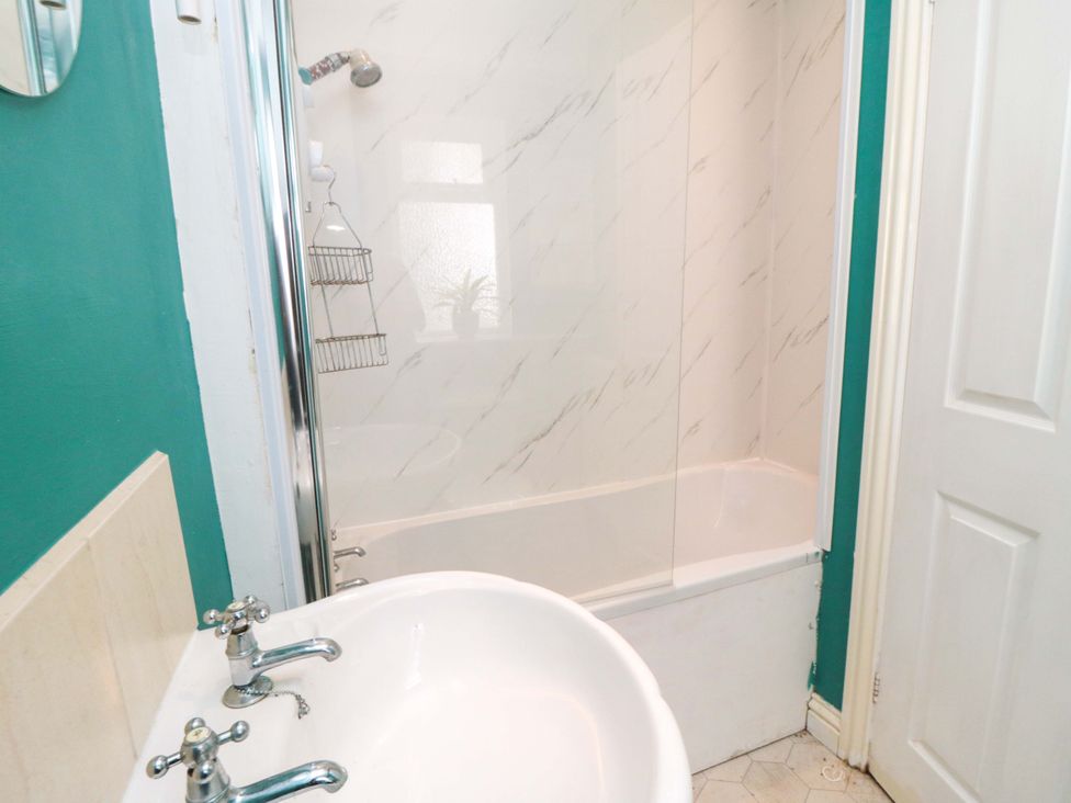 A bathroom featuring a bathtub and shower at The Annex in York