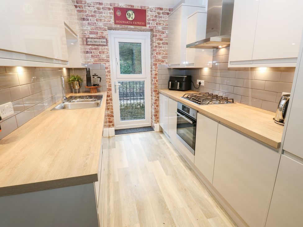 A kitchen with sink and appliances at 12 River View in Keighley
