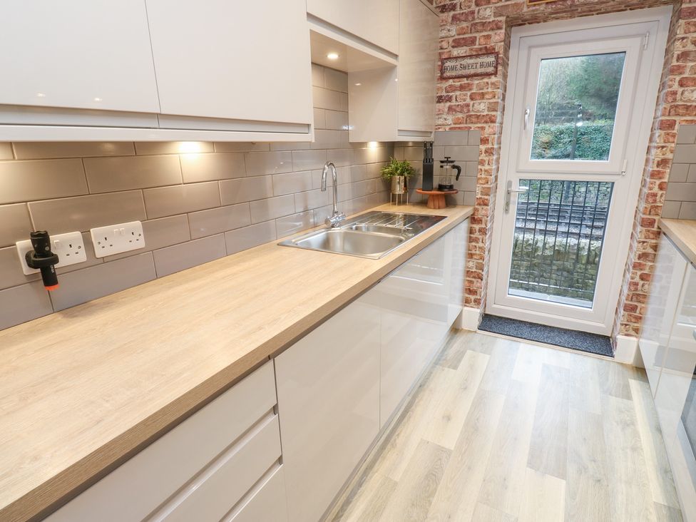 A kitchen with countertop and sink at 12 River View Keighley