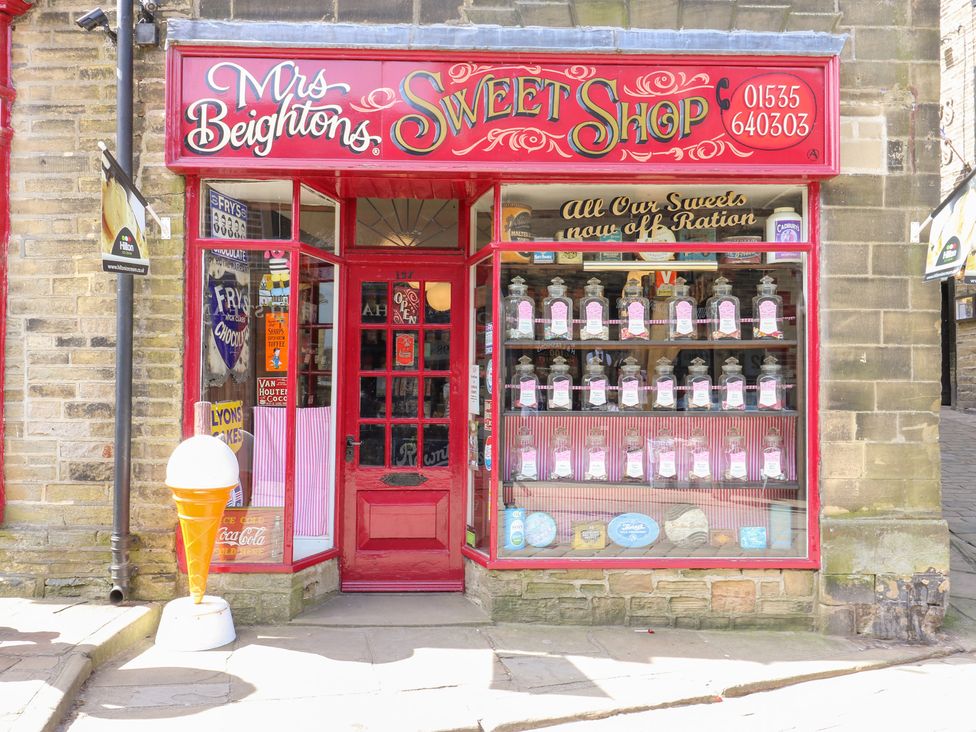 The front of a sweet shop with jars of sweets at Mrs Beighton's Sweet Shop in Keighley