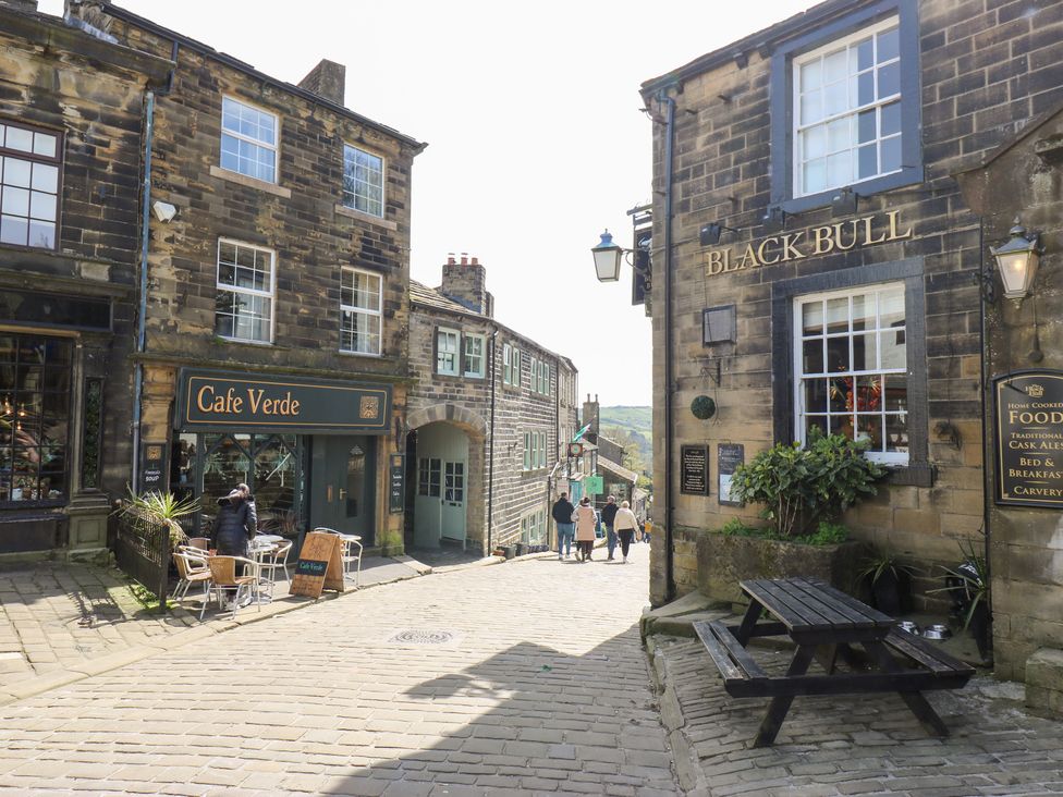 A street view with Cafe Verde and Black Bull in Keighley