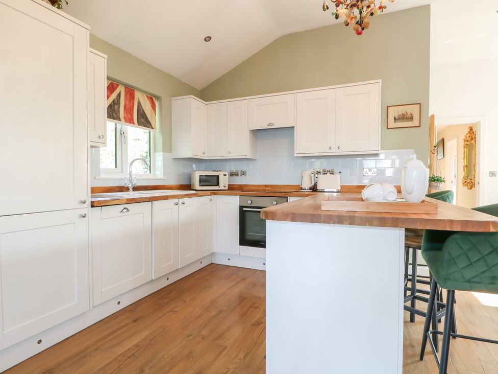 A kitchen with cabinets and a countertop at El-Nido in Alton