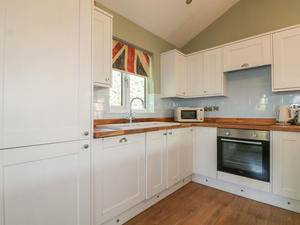 A kitchen with cabinets and appliances at El -Nido Alton