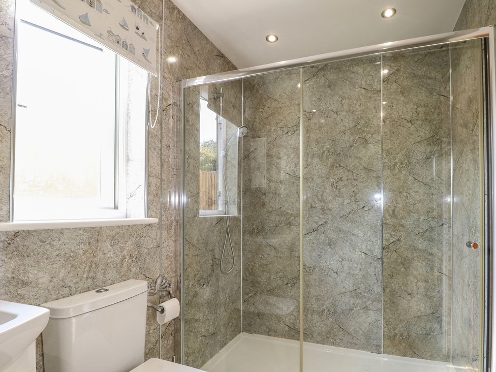 A bathroom with a shower and toilet at El -Nido in Alton
