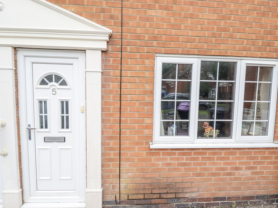 A front door and window of a house at 5 Links Court Skegness