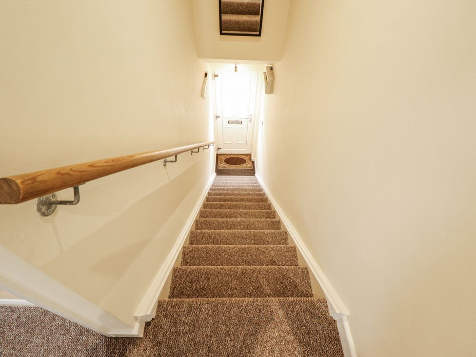 A staircase leading to a door at 5 Links Court in Skegness