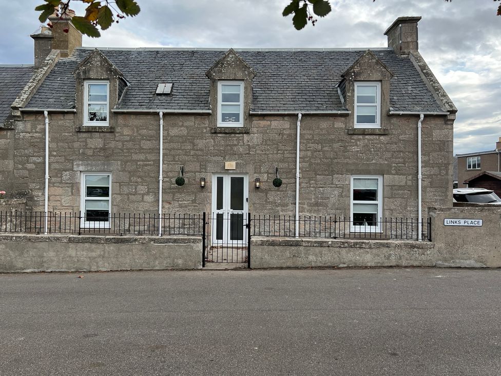 A house with windows and a door at 1 Links Place in Nairn