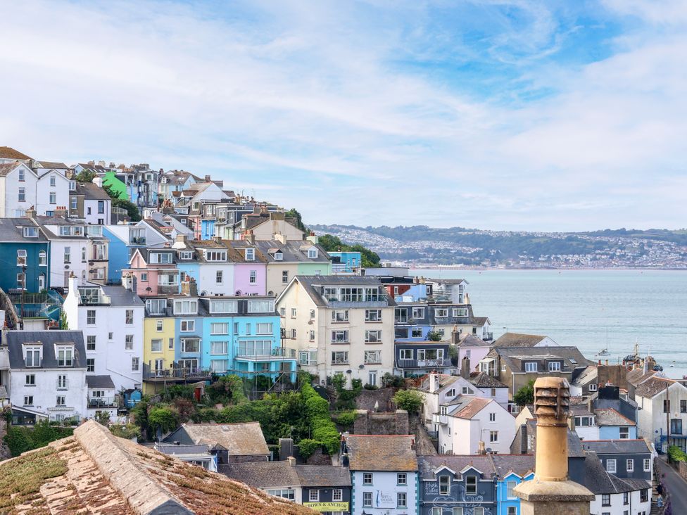 A view of colorful houses overlooking the sea at 45 North View in Brixham