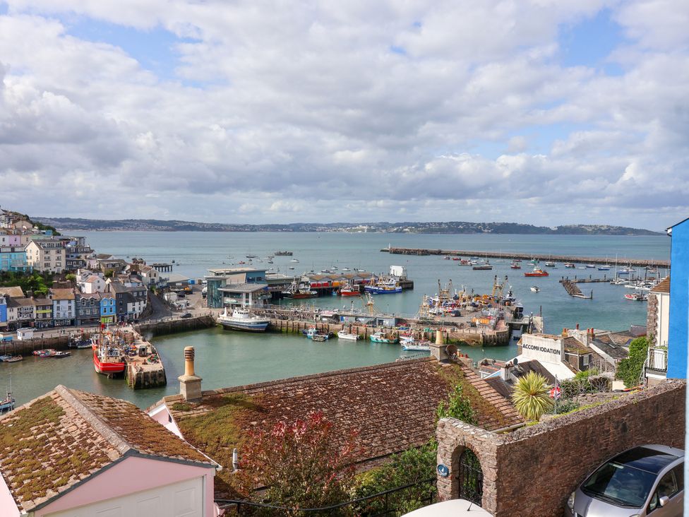 A view of the harbor with boats and houses at 45 North View in Brixham