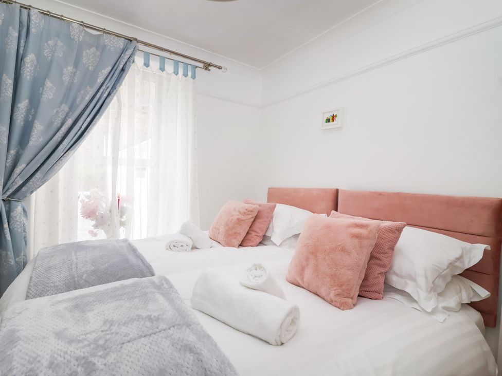 A bedroom with a bed and pillows at 45 North View Brixham
