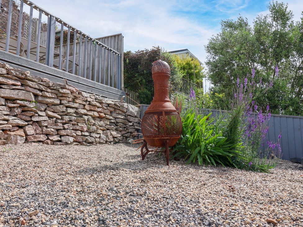 A garden with a chiminea and gravel at 45 North View in Brixham