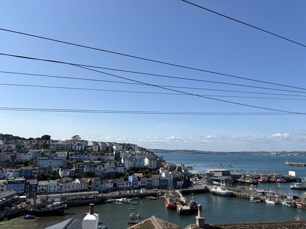A view of colorful houses and boats in the harbor at 45 North View in Brixham
