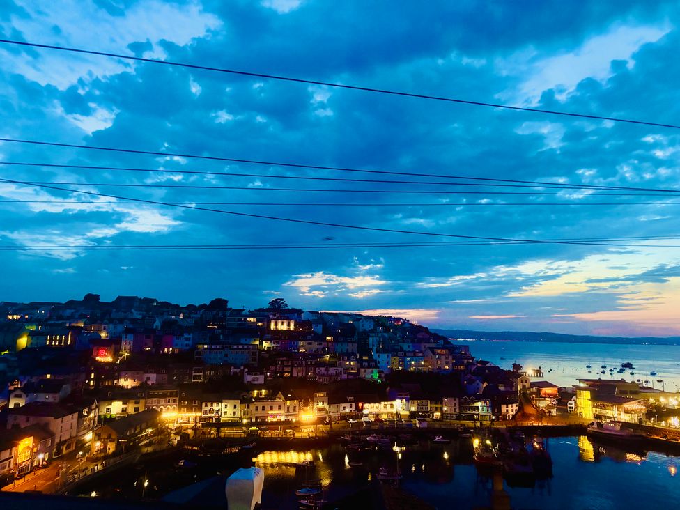 A view of a harbor with houses and boats at Lizzy’s Cottage in Brixham