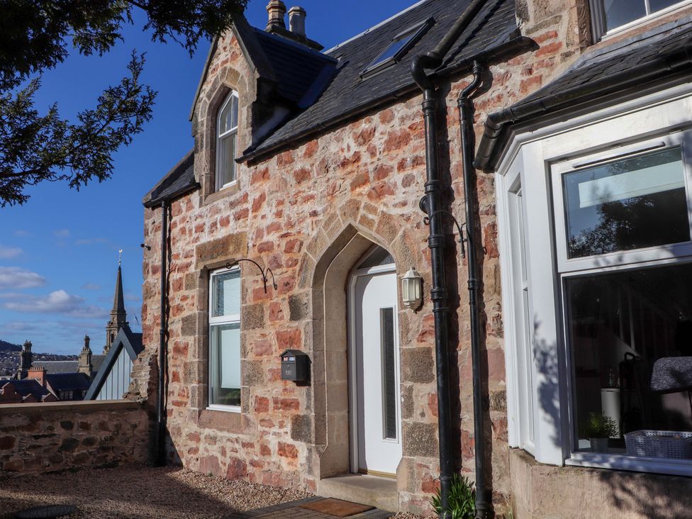 A house exterior with a door and windows at View Cottage in Inverness