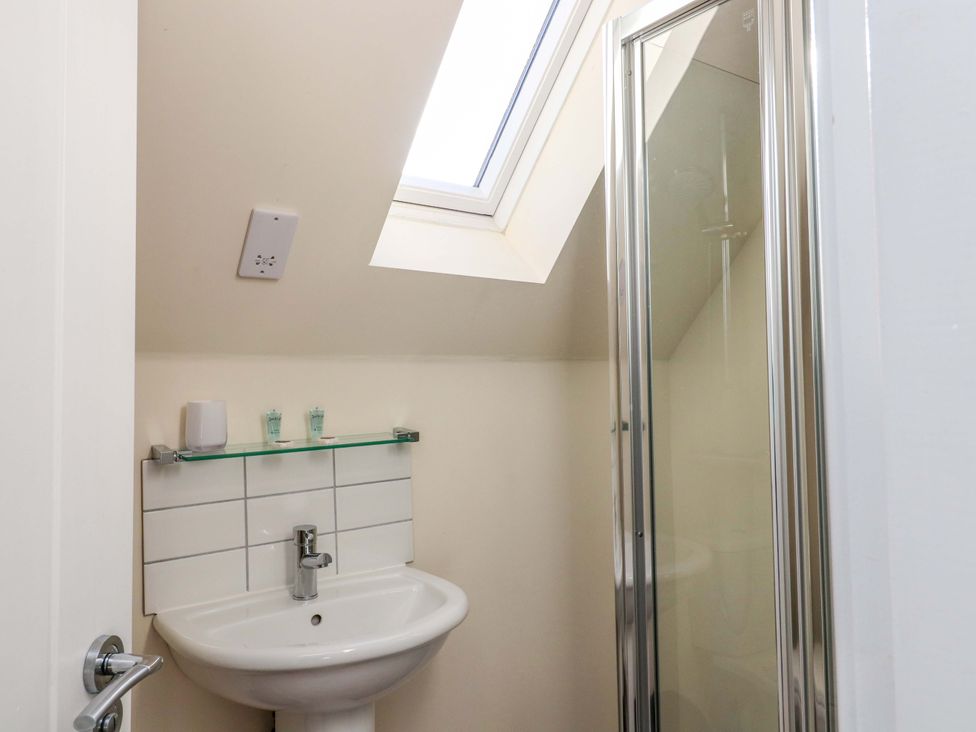 A bathroom with a shower and sink at View Cottage in Inverness