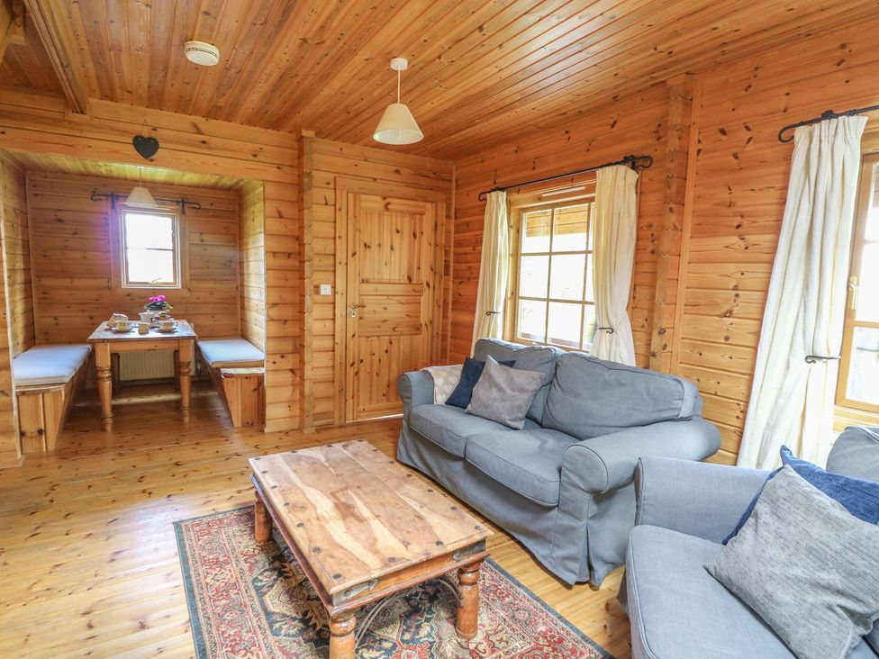 A living room with a sofa and coffee table at Pen Y Clawdd Beggar's Bush near Presteigne