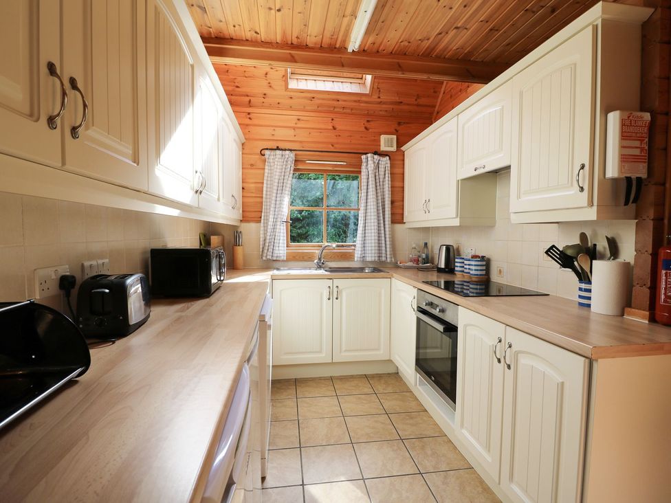 A kitchen with cabinets and appliances at Pen Y Clawdd Beggar's Bush near Presteigne
